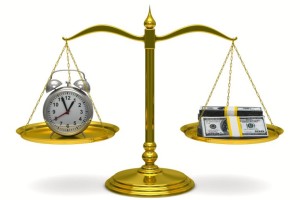 scales showing clock and money