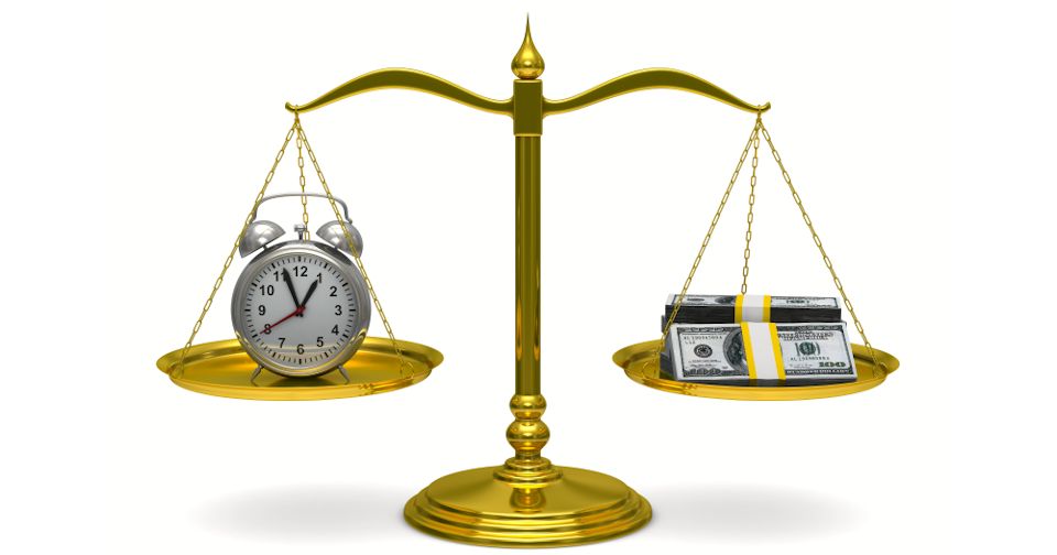 scales showing clock and money